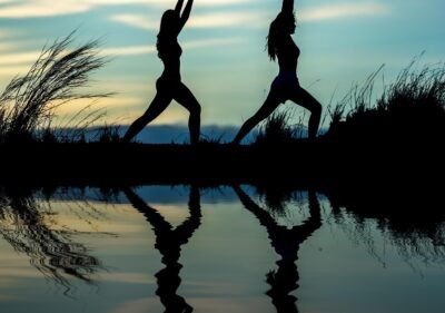 women, yoga, silhouettes, water, reflection, mirroring, water reflection, pose, posing, yoga pose, meditation, stretching, wellness, well-being, exercise, adults, asia, girls, morning, outdoors, nature, pair, people, stance, sunrise, sunset